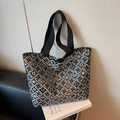 Women's black floral tote bag with silver geometric patterns and sturdy handles - Black