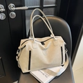 Beige large capacity travel duffel bag with NING JIA logo and wide shoulder strap - Gray