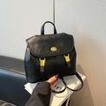 Classic black leather backpack with lychee texture and gold metal hardware lock detail - Black
