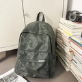 Close-up of camouflage waterproof backpack with front zipper pocket and side mesh pouch - Green Camouflage