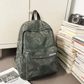 Detail of waterproof green camouflage backpack with texture and front zipper pocket - Green