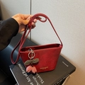 Red glossy leather saddle bag with cherry charm and golden fashion logo print - With Charm / Burgundy