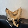 Minimalist khaki pleated dumpling crossbody bag with adjustable wide strap and white zippers - Khaki