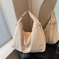 Chic beige canvas tote bag with functional zippers and spacious minimalist design - Off-white