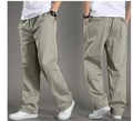 Detailed view of khaki cargo pants featuring elastic waist and functional side pockets - M / Light Gray