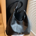 Minimalist black tote bag with wrinkled leather texture and gold hardware detail - Black