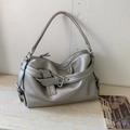 Metallic silver tote bag with lychee texture and buckle strap on marble background - Silver