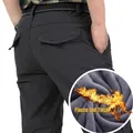 Dark grey men's winter tactical pants featuring warm thick fleece lining and cargo pockets - M (Approx. 57kg) / Fleece Lined Gray