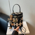 Quilted cylinder handbag in black and beige canvas with a cute rabbit charm accessory - Black with Pendant