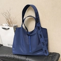 Deep blue nylon tote bag with adjustable wide shoulder strap and drawstring detail - Blue