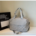 Light grey quilted travel bag with adjustable strap and large capacity design - Gray