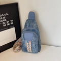 Blue denim crossbody sling bag featuring vintage wash and floral embroidery strap - Vintage Blue