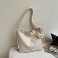 Minimalist creamy white leather tote bag with a cute plush bear and striped ribbon charm - Off-white