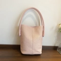 Pink woven bucket bag with stylish vertical textures and thin shoulder straps for women - Pink