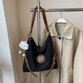Retro black canvas hobo bag with brown leather trim, metal M logo and plush pendant accessory - Black with Pendant