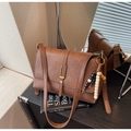 Close-up of vintage brown leather crossbody bag with decorative beads and metal buckle - Brown with Pendant