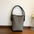 Minimalist woven bucket bag in grey fabric with black leather straps for summer style - Black