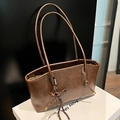 Classic vintage brown tote bag with leather texture and woven tassel pendant - Brown with Pendant