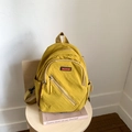 Mochila de nailon amarillo mostaza para mujer con bolsillo frontal y compartimentos laterales - Amarillo