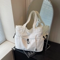 White nylon tote bag with functional drawstring pockets and wide shoulder strap - White
