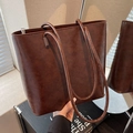 Vintage brown leather tote bag with glossy finish and long shoulder straps for daily use - Brown