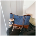 Detail of denim tote bag with leather trim, metal chain strap and cute bear charm pendant - With Bear Pendant / Blue/Brown Patchwork