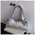 Chic silver metallic rivet shoulder bag with Y2K aesthetic on artistic background - Silver