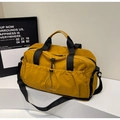 Large mustard yellow travel bag with cross-body strap and multi-compartment design - Yellow