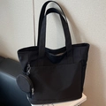 Minimalist black tote bag in durable nylon with matching round coin purse pendant - Black