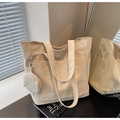 Large beige tote bag with shoulder strap and circular coin purse charm detail - Off White