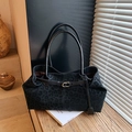 Black leopard print tote bag with gold buckle and matte suede finish in warm room setting - 36*12*20 / Black