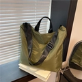Olive green nylon tote bag with black adjustable strap for high capacity shoulder use - Green