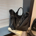 Large black nylon travel tote bag with adjustable shoulder strap and dual handles - Black