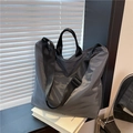 Waterproof dark grey nylon tote bag with black adjustable shoulder strap and handles - Gray