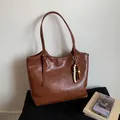 Brown vintage leather tote bag with unique wooden bead tassel and adjustable shoulder strap - Brown with Pendant