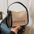 Beige canvas crossbody bag with black leather trim and top handle for women - Beige