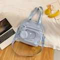 Light blue canvas tote bag with clear display window and bow embroidery detail - Blue