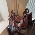 Dark brown faux leather crossbody bag with a horse charm and textured glossy surface - Coffee with Pendant