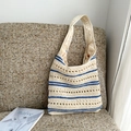 Chic beige woven bucket bag with blue horizontal stripes and hollow knit texture - Blue