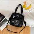 Black canvas tote bag with transparent window, purple bow, and adjustable strap - Black