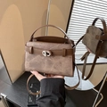 Dunkelbraune Retro-Beuteltasche mit silbernem Drehverschluss und Umhängeriemen - Braun