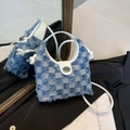 Blue and white checkered denim bucket bag with leather handles and metallic twist lock - Light Blue