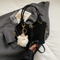 Glossy black vintage bucket bag with metal buckle and cute white plush charm - Black