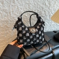 Mini checkered bucket bag in black and white tweed with a metallic twist-lock closure - Black