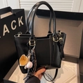 Retro black leather bucket bag with top handles, crossbody strap and baseball charm - With Charm Style / Black with Pendant