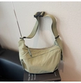 Detail of light green crescent nylon bag with adjustable strap and plastic buckle - Green