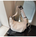 Detail of off-white dumpling bag with wide adjustable strap shown in a mirror reflection - Off White