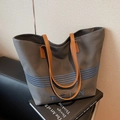 Large gray canvas tote bag with blue stripes and brown leather handles in variant view - Dark Brown