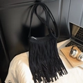 Fashionable black tassel crossbody bag in matte suede finish with long shoulder strap - Black