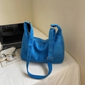 Bright blue suede crossbody tote bag with adjustable strap and silver metal buckle - Blue Without Charm